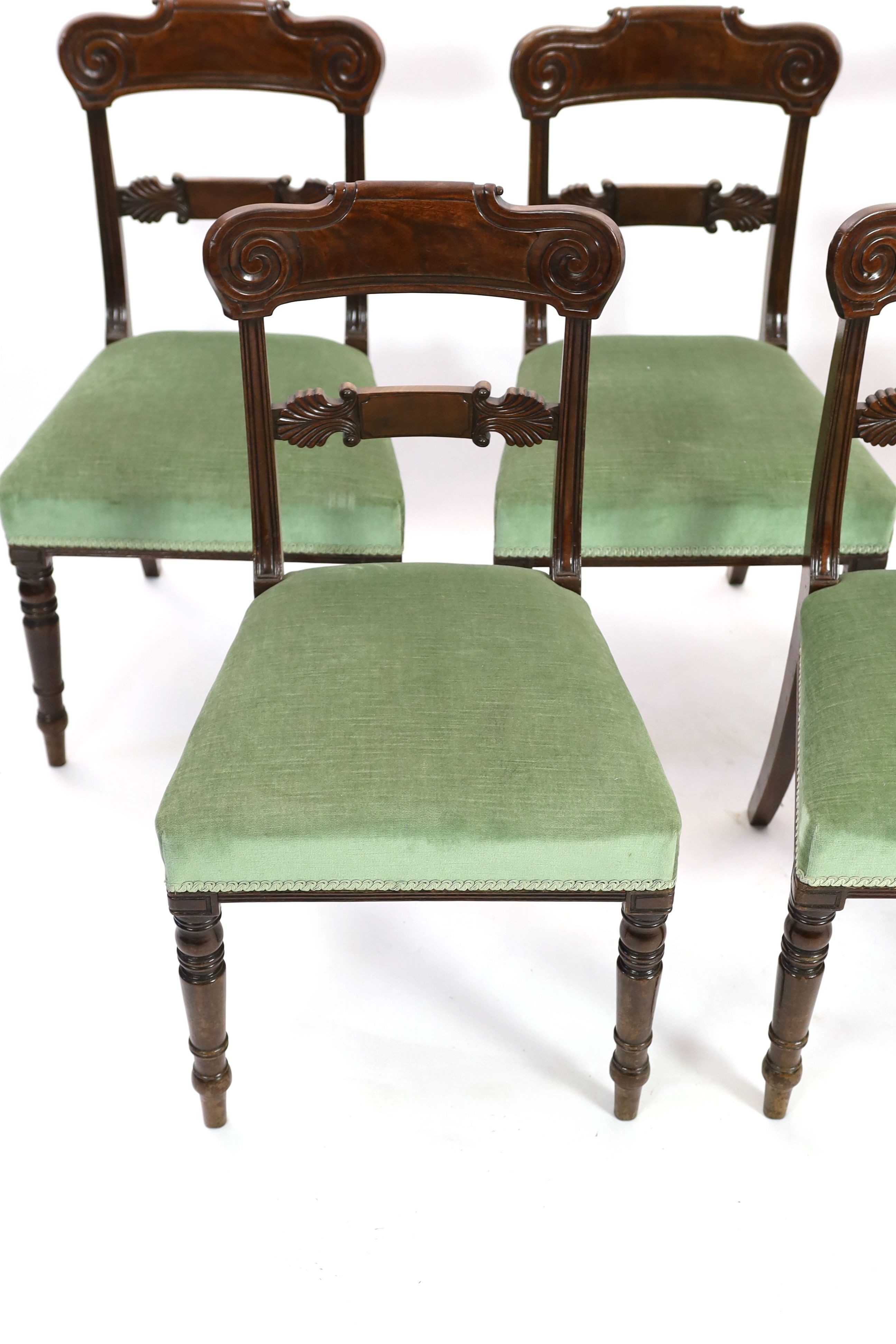 A set of six Regency mahogany dining chairs, with anthemion carved spars